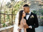 Couple in vine tunnel